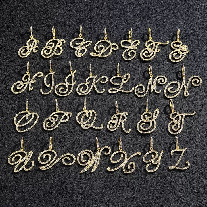 Gold-tone stone-set script alphabet pendants arranged from A to Z