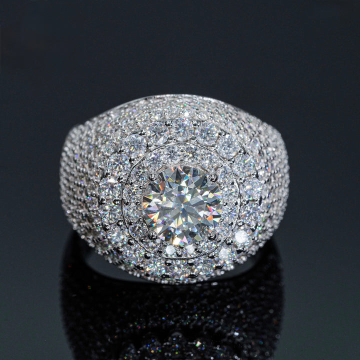 Wide silver-tone ring with a round center stone and stone-set face