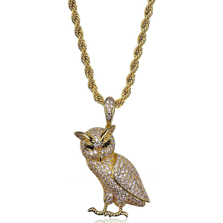 Gold-tone stone-set owl pendant on a rope chain against white