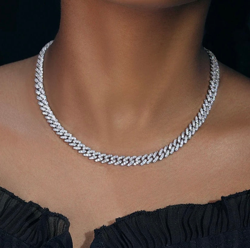 Close-up of a woman wearing a sparkling iced out tennis chain necklace - Miles Jewellery