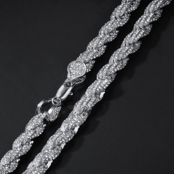 Close-up of silver-tone twisted rope links and an open clasp