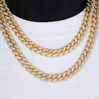 Two gold Cuban link chains with sparkling stones on white background - Miles Jewellery