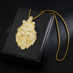 Gold lion pendant necklace on a black box