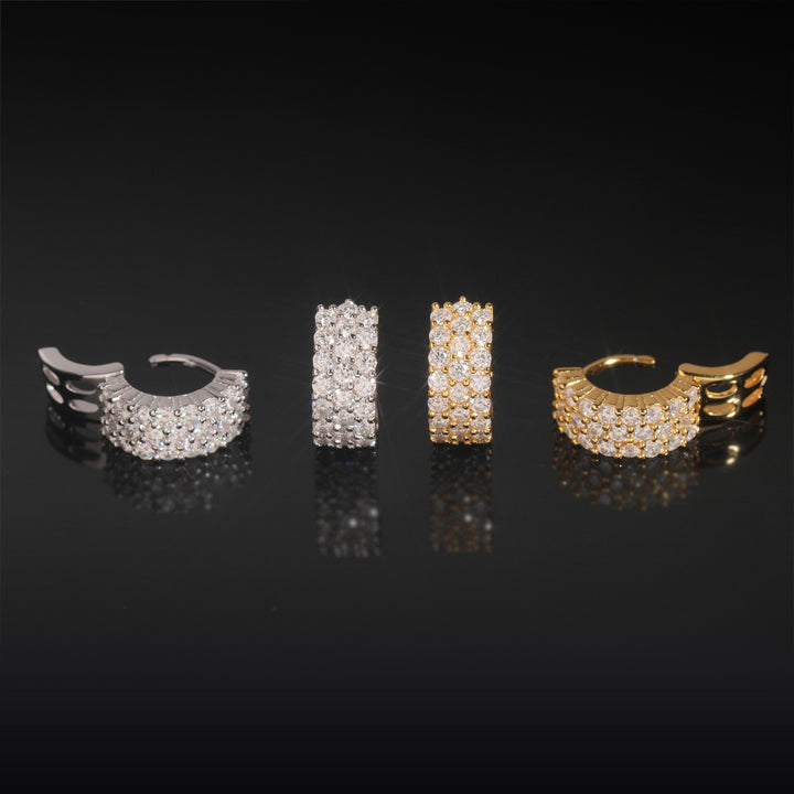 Front and side views of gold-tone and silver-tone stone-set hoop earrings