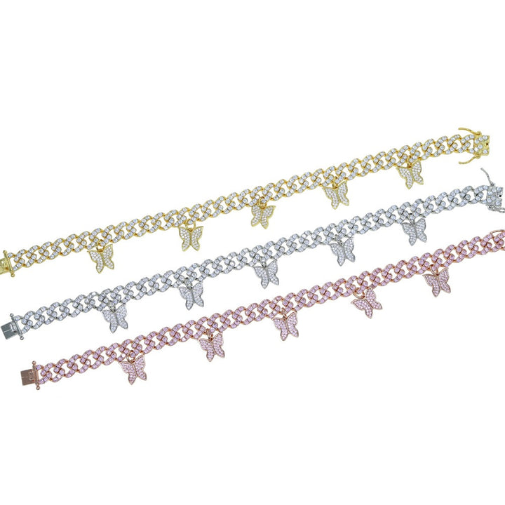 Gold-tone, silver-tone and pink-tone butterfly-charm bracelets arranged side by side