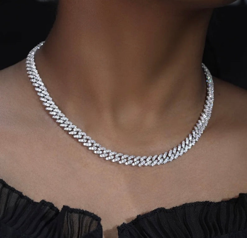 Iced out Cuban link chain necklace with sparkling stones on woman's neck - Miles Jewellery