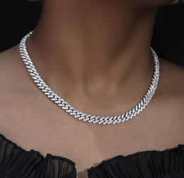 Iced out Cuban link chain necklace with sparkling stones on woman's neck - Miles Jewellery