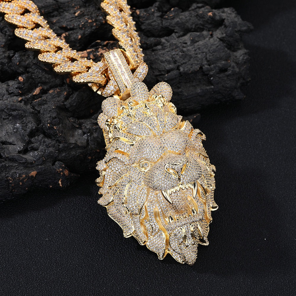 Gold lion pendant necklace on a dark background