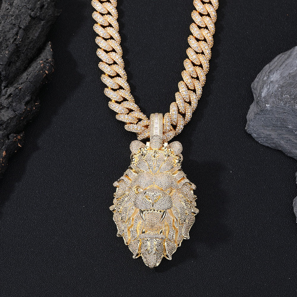 Gold chain necklace with a detailed pendant on a black background