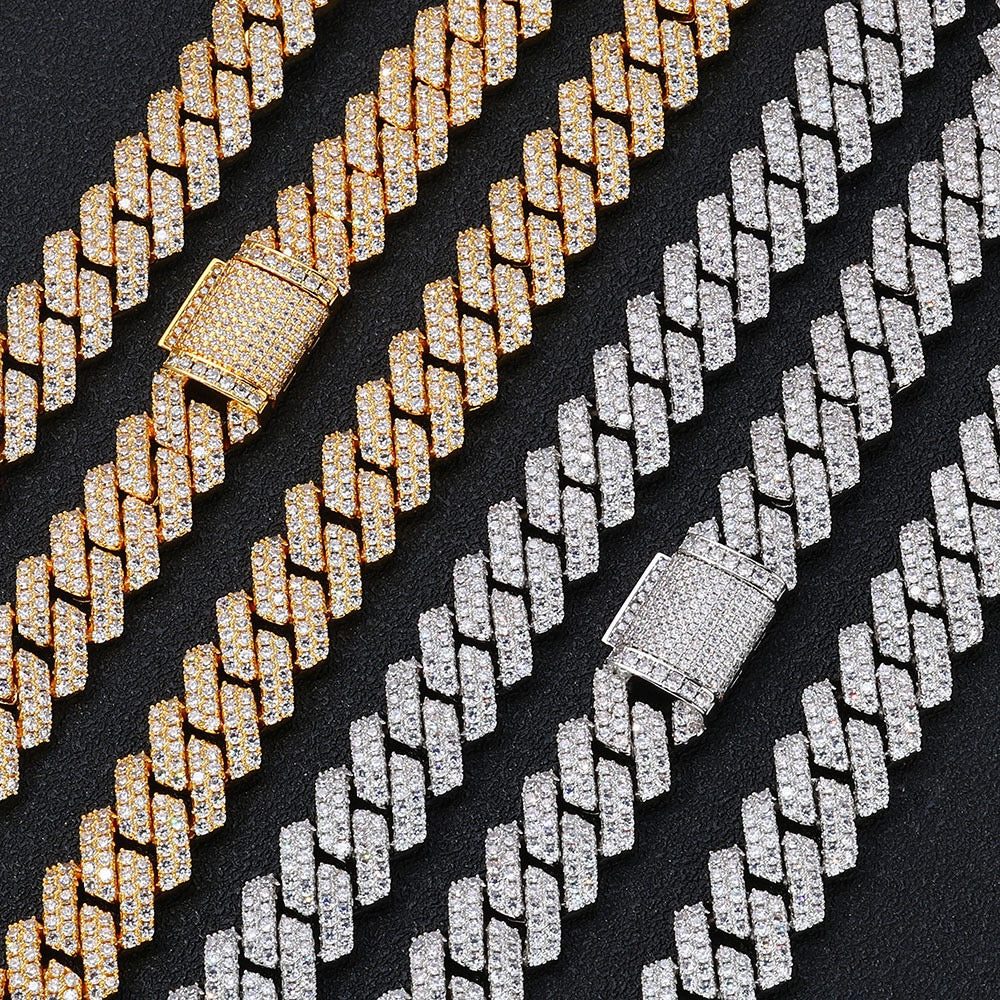 Gold and silver iced out Cuban link chains with diamond clasps on black background - Miles Jewellery
