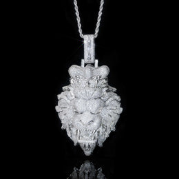 Silver lion head pendant necklace on a black background
