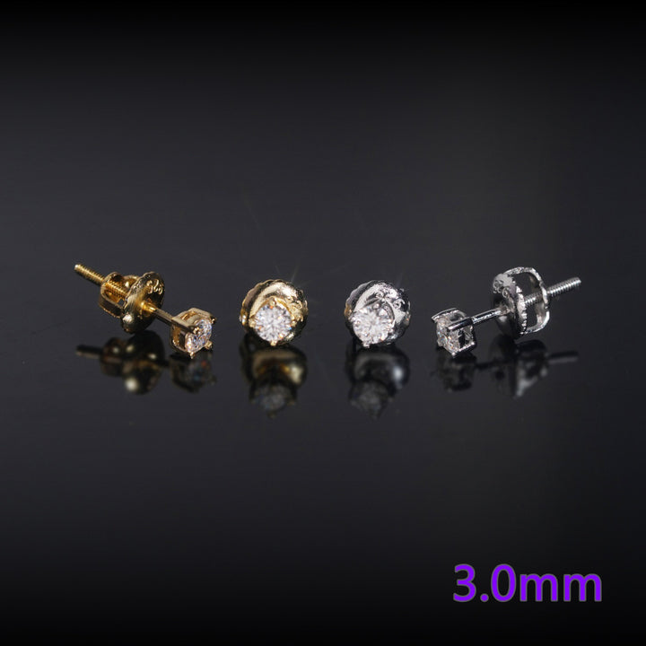Two pairs of 3.0mm stud earrings displayed on a reflective black surface, showing both gold and silver finishes with moissanite.