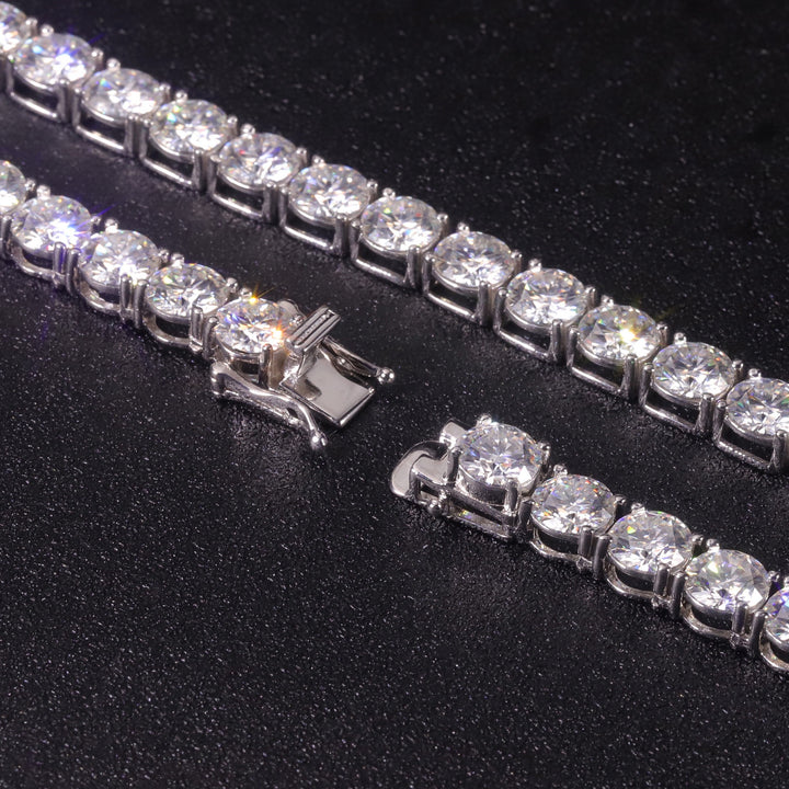 Close-up of the open clasp on a silver-tone tennis chain