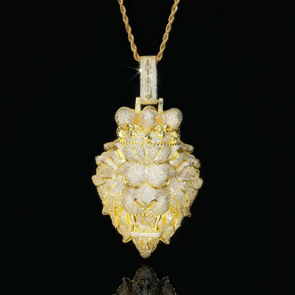 Gold lion pendant necklace on a black background