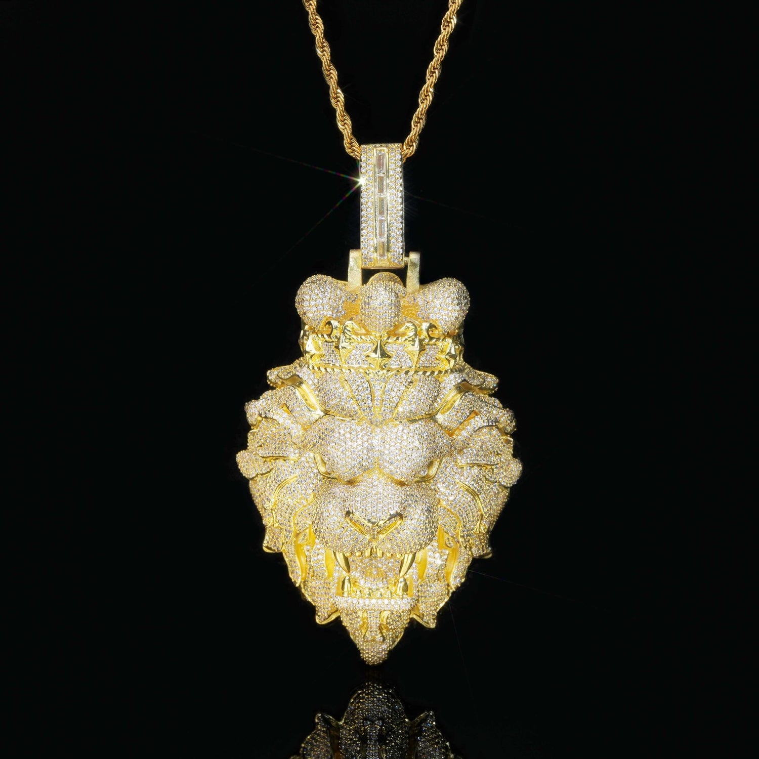 Gold lion pendant necklace on a black background