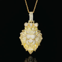 Gold lion pendant necklace on a black background