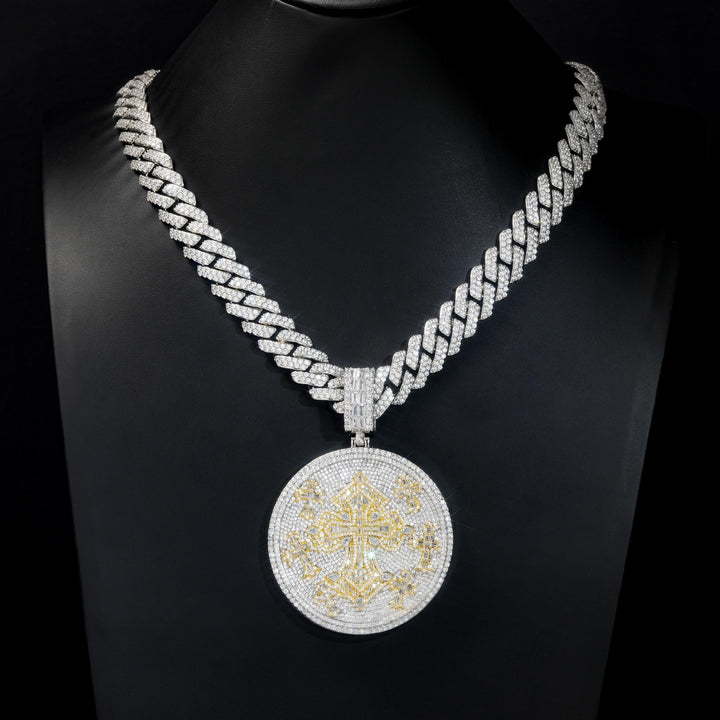 Round cross medallion hanging from a Cuban link chain on a display bust