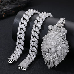 Silver chain bracelet and lion head pendant on a black background