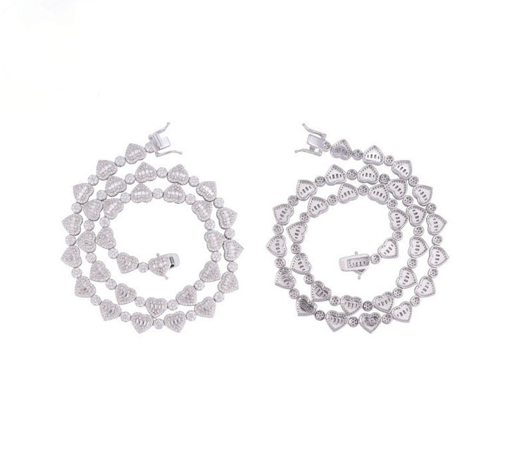 Backs of coiled heart-link chains showing open stone settings