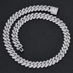 Iced out Cuban link chain with pave stones on black background - Miles Jewellery
