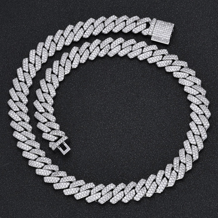 Iced out Cuban link chain with pave stones on black background - Miles Jewellery