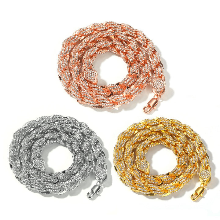 Pink-tone, silver-tone and gold-tone twisted rope chains coiled on white