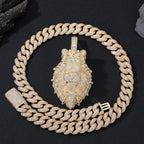Gold chain necklace with a lion pendant on a black background