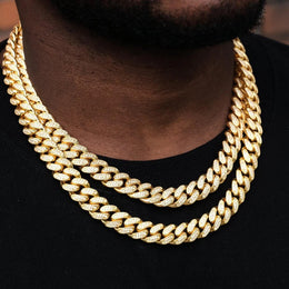 Man wearing two gold Cuban link chains with diamonds, hip hop jewelry style - Miles Jewellery