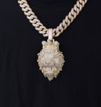 Luxury diamond-encrusted lion pendant on a thick chain against a black background