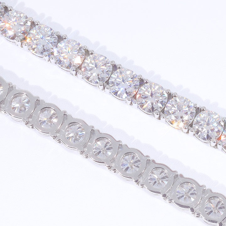 Front and back of a silver-tone tennis chain showing the stone settings