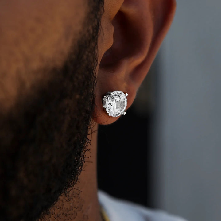 Close-up of a clear round stud earring worn on an earlobe