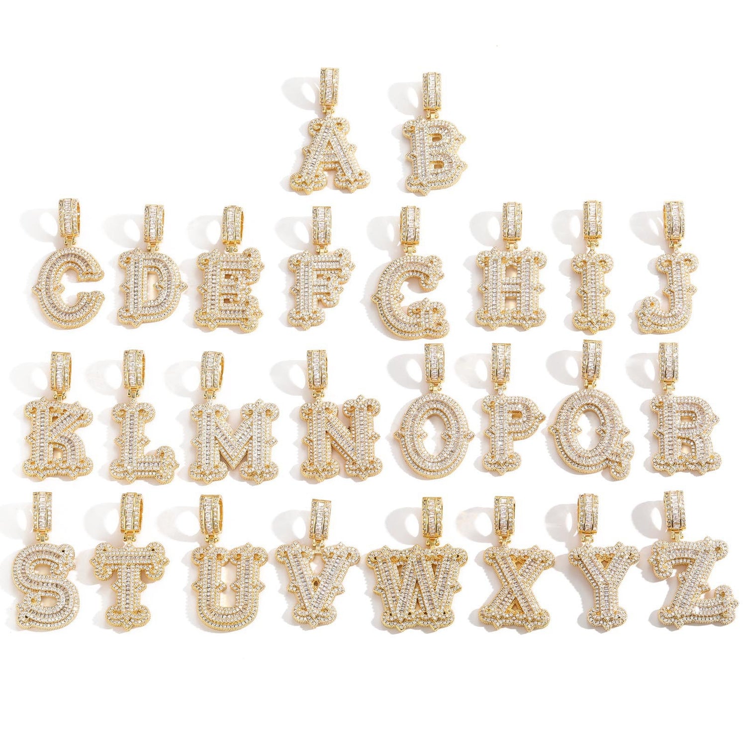 Gold-tone stone-set alphabet pendants arranged in rows on white