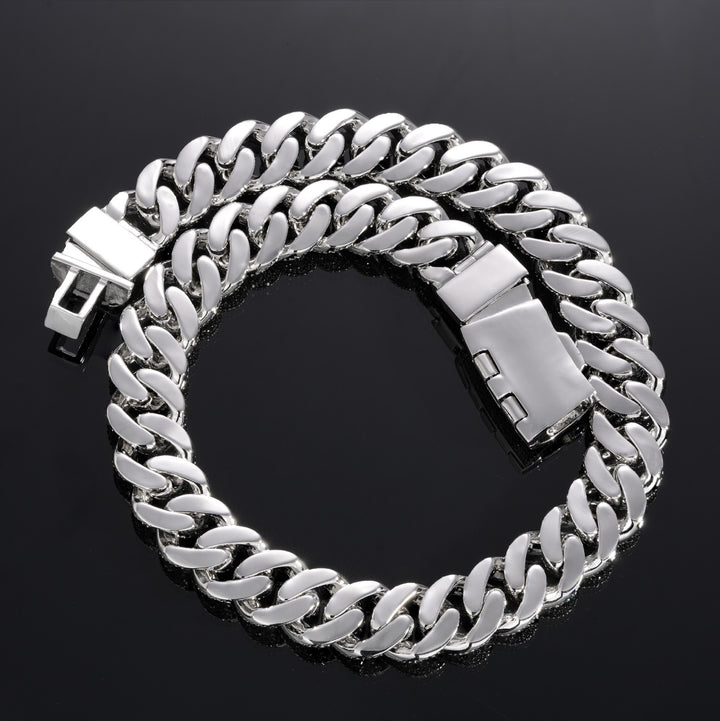 Back of a silver-tone Cuban link chain showing polished links and box clasp