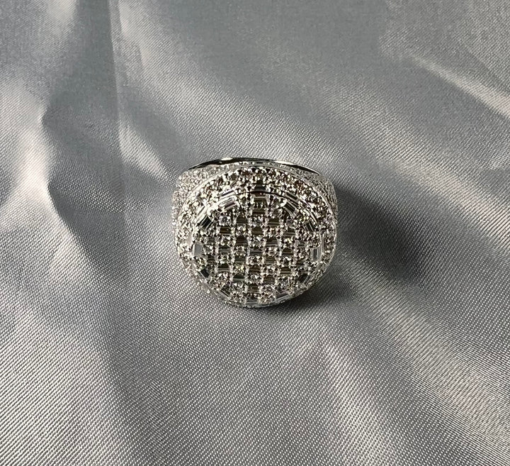 Round stone-set signet ring on pale fabric