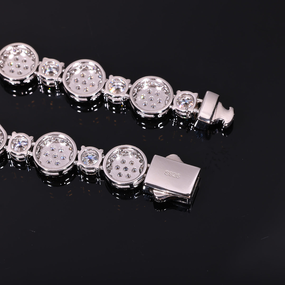 Back of a silver-tone halo tennis chain showing link openings and S925 mark on the box clasp