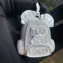 Close front view of the silver-tone backpack pendant and raised pocket detail