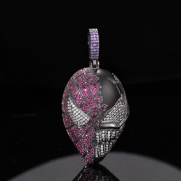 Dark silver-tone fanged mask pendant with pink and clear stones and a purple stone-set bail