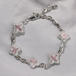 Pink four-leaf clover adjustable bracelet shown in supplier styling