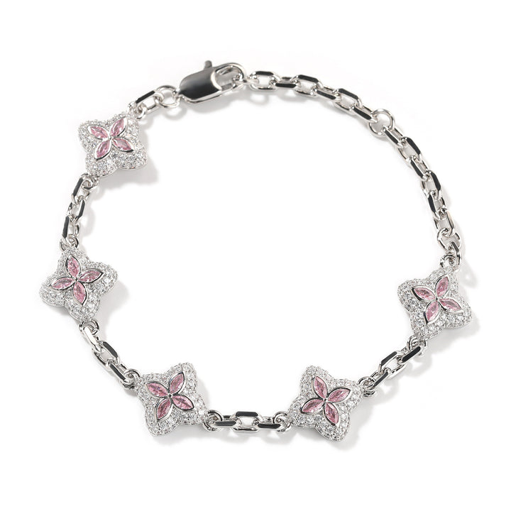 Pink four-leaf clover adjustable bracelet in a silver-tone setting on white