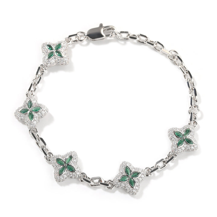 Green four-leaf clover adjustable bracelet in a silver-tone setting on white