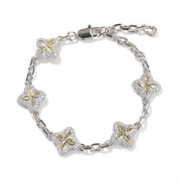 Yellow four-leaf clover adjustable bracelet in a silver-tone setting on white