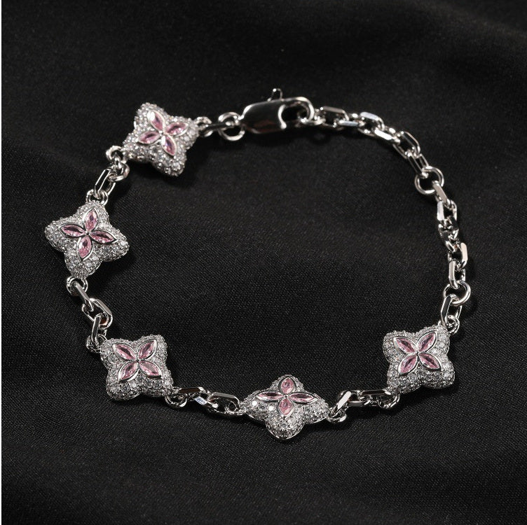 Pink four-leaf clover adjustable bracelet shown in supplier styling