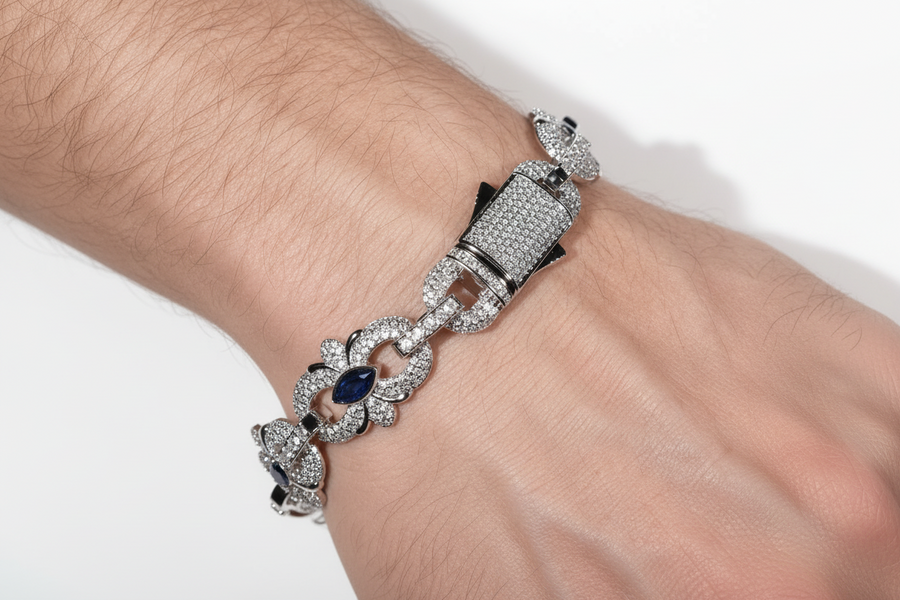 Blue marquise floral link bracelet worn on a wrist with the pavé box clasp visible