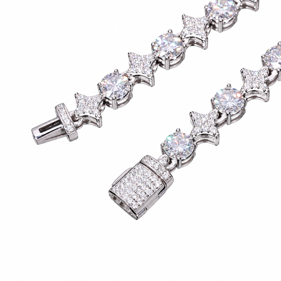 Silver-tone moissanite star links, round stones and open box clasp detail on white