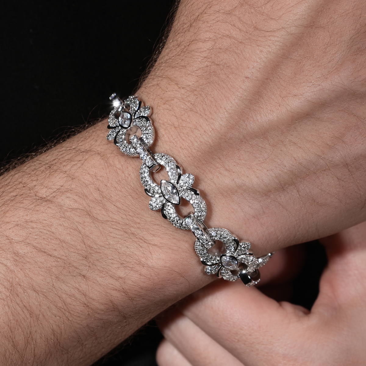 Marquise floral link bracelet with clear cubic zirconia worn on a wrist