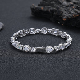 Silver-tone geometric bracelet showing the box clasp on dark stone