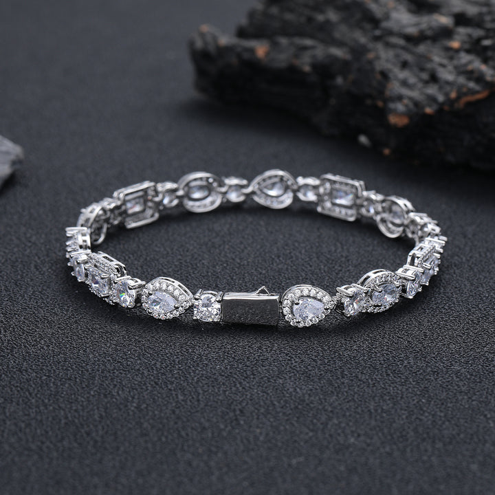 Silver-tone geometric bracelet showing the box clasp on dark stone