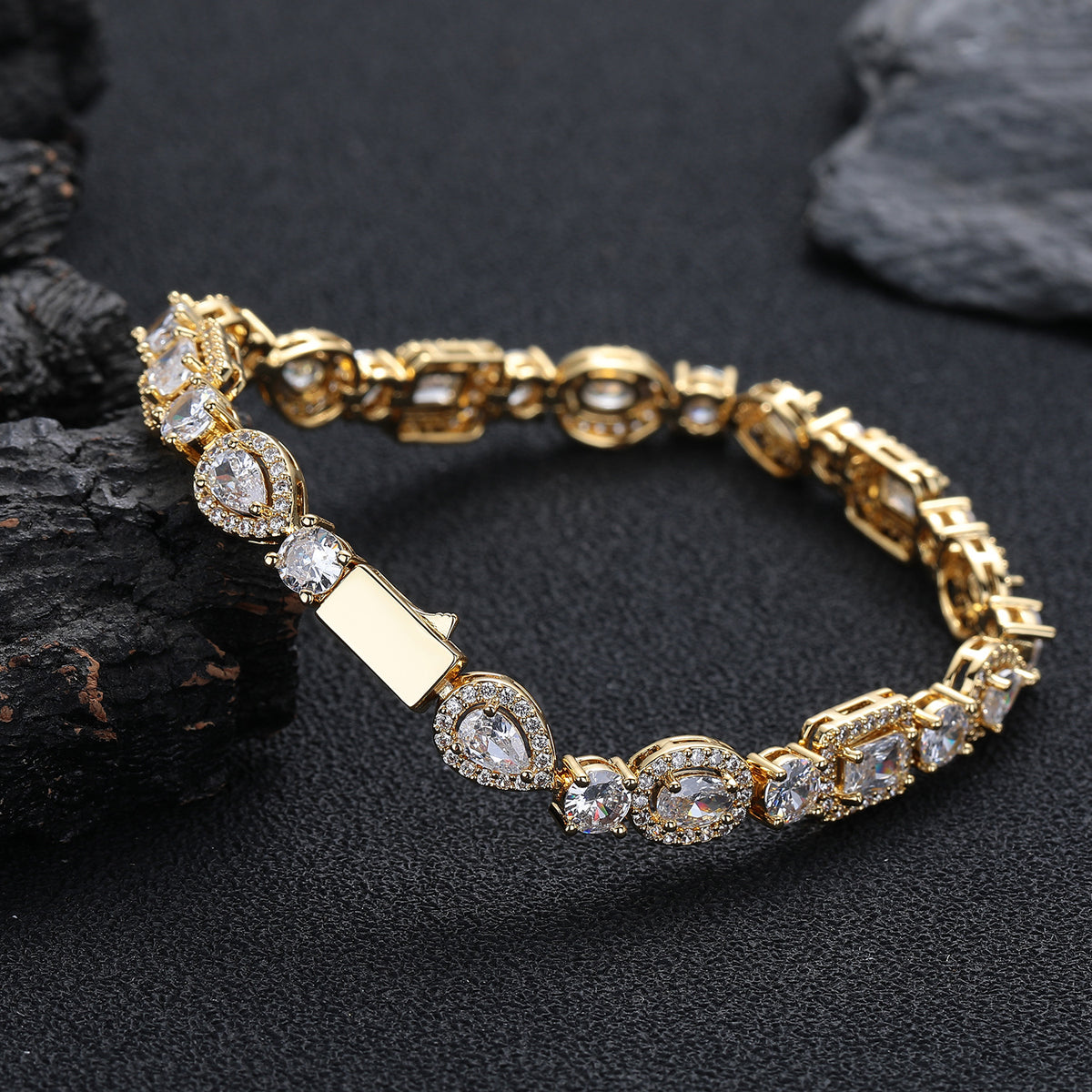 Gold-tone geometric bracelet showing the box clasp and back of the links