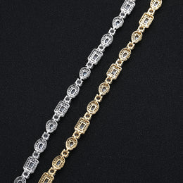 Back view of silver-tone and gold-tone geometric bracelet settings
