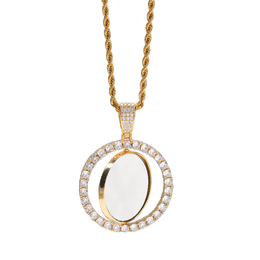 Hanging gold-tone photo pendant showing the white inner disc rotated within the stone-set frame